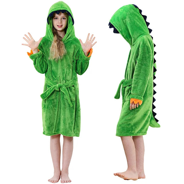 Green dinosaur-themed robe worn by a child on a white background