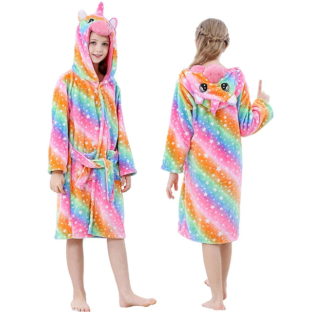 Girl wearing a unicorn hooded dressing gown with front and back view of the garment