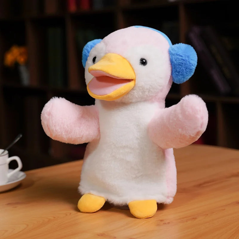 Plush toy bird on a wooden table, with a blurry background.