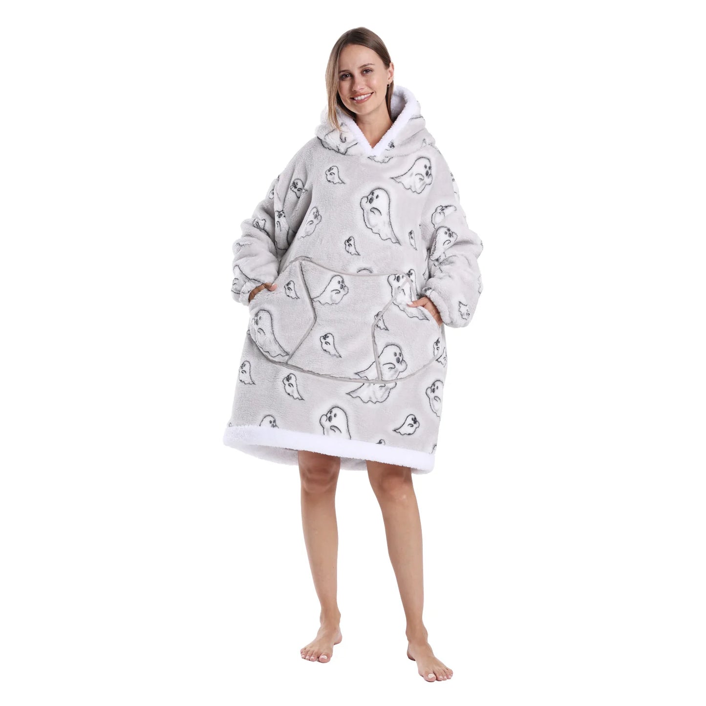 Person wearing a grey hoodie with cartoon ghost designs on a white background