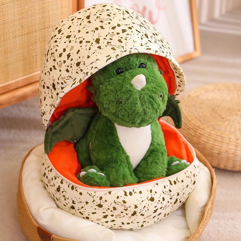 Soft plush dragon egg with removable dragon sat in the egg that is half closed.
