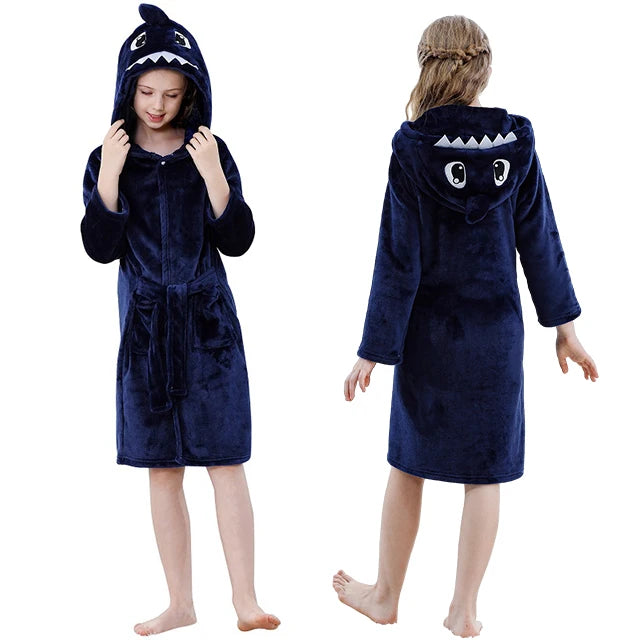 Navy shark-themed robe worn by a child on a white background