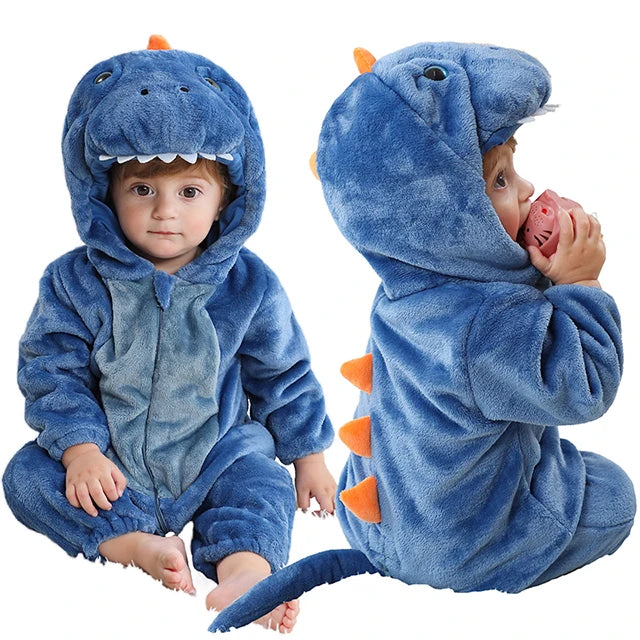 Two children wearing blue dinosaur onesie on a white background