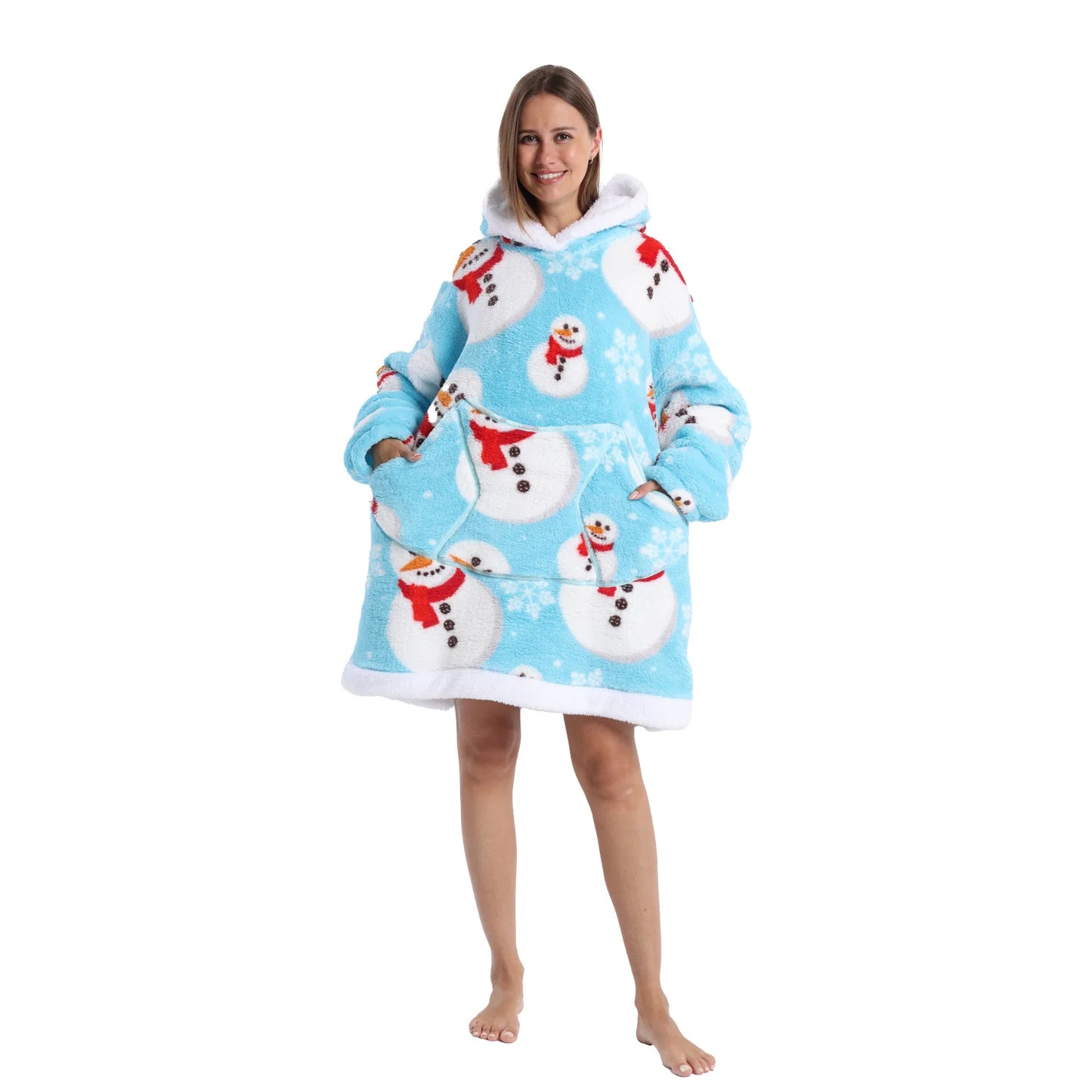 Woman wearing a blue oversized Christmas themed hoodie with snowman motifs