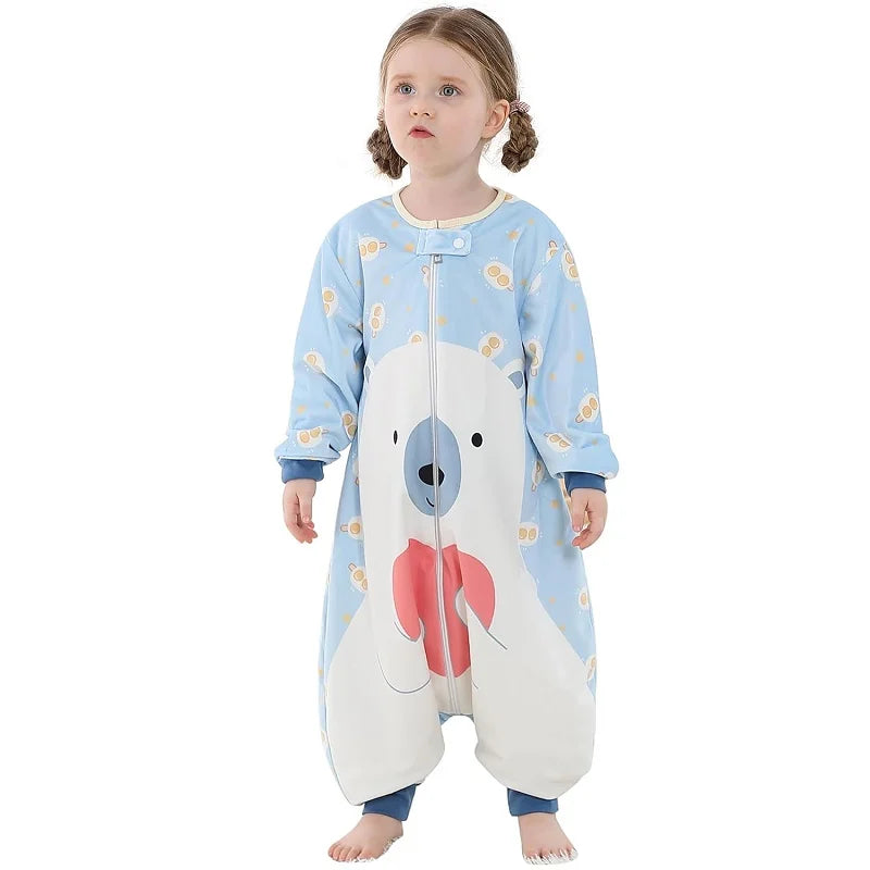 Child wearing a blue onesie with a bear design on a white background