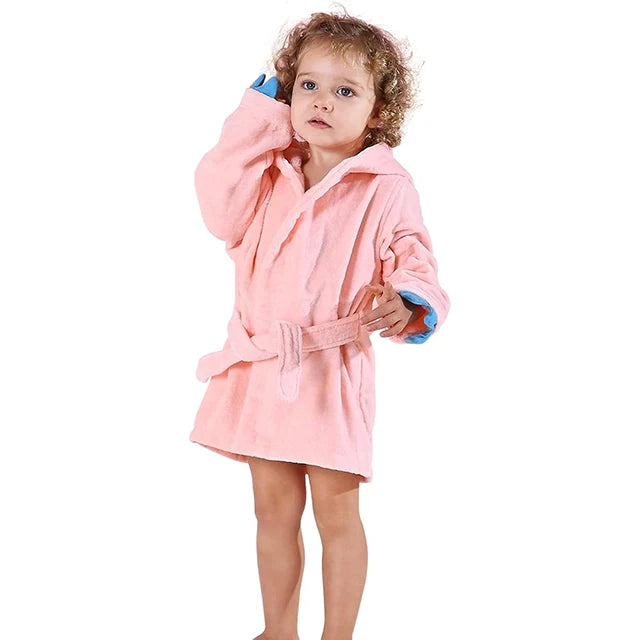Light pink dinosaur-themed hooded baby bathrobe made from soft bamboo fabric with belt tie