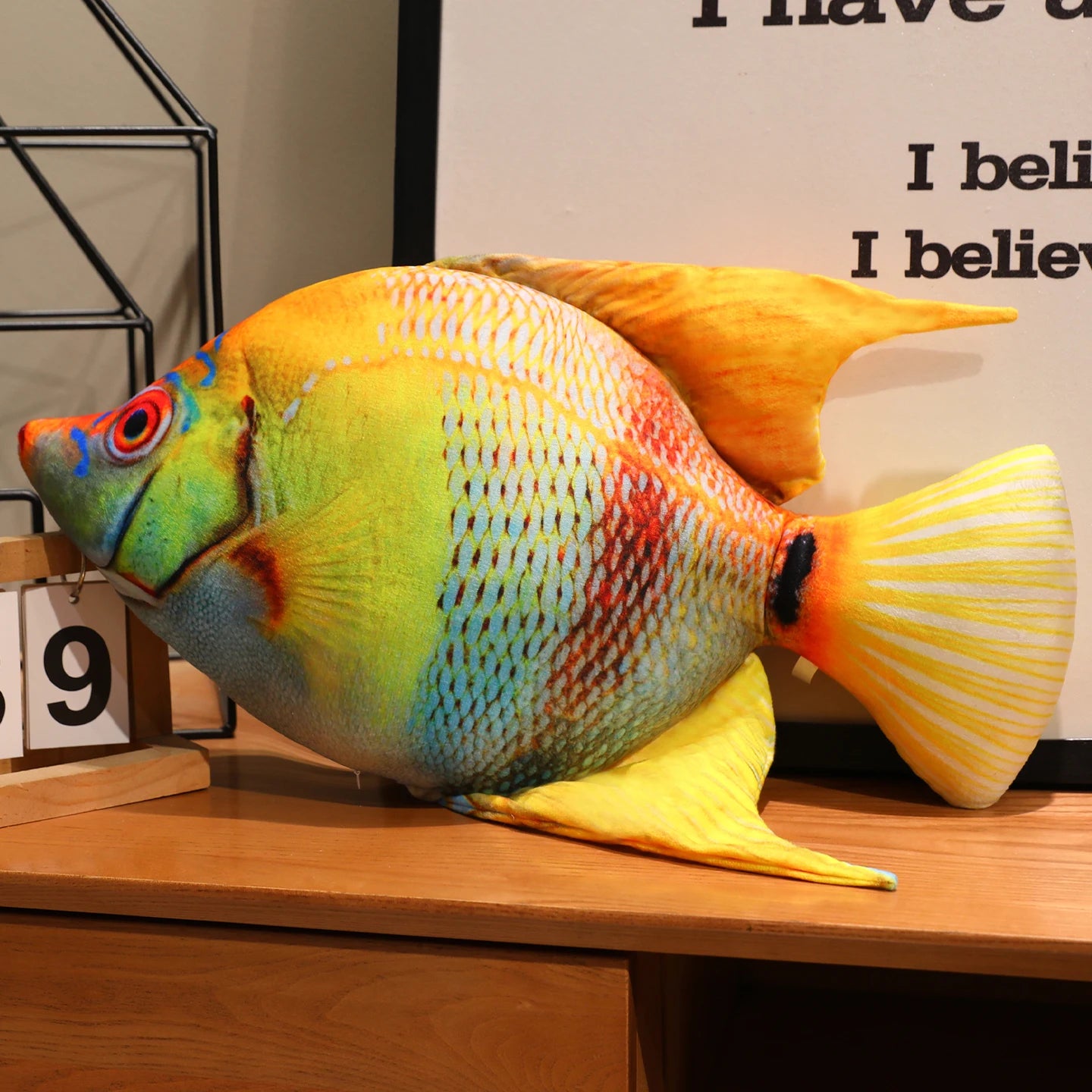 Blue and orange fish soft toy with a realistic printed scale pattern