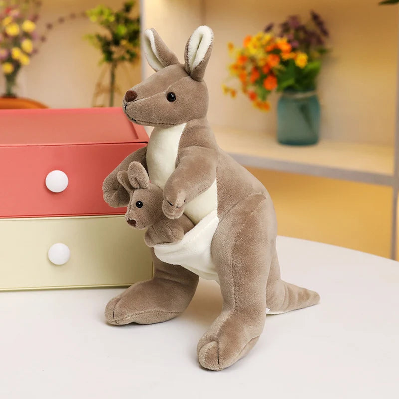 Kangaroo soft toy with joey in pouch, featuring a soft grey-brown plush finish and white belly