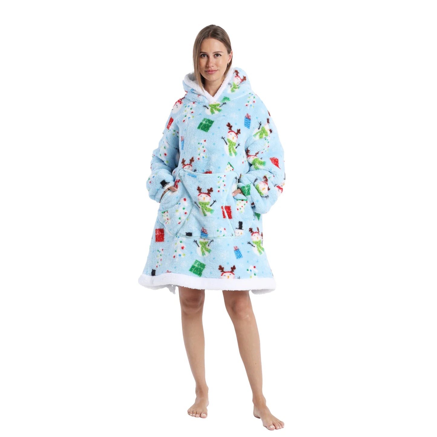 Woman wearing a blue oversized Christmas themed hoodie with snowman and gift motifs