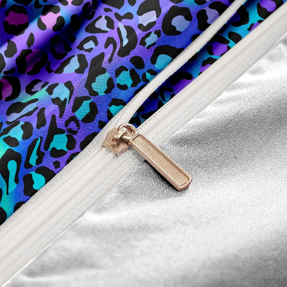 Close-up of a duvet with a purple leopard print fabric and a zipper.