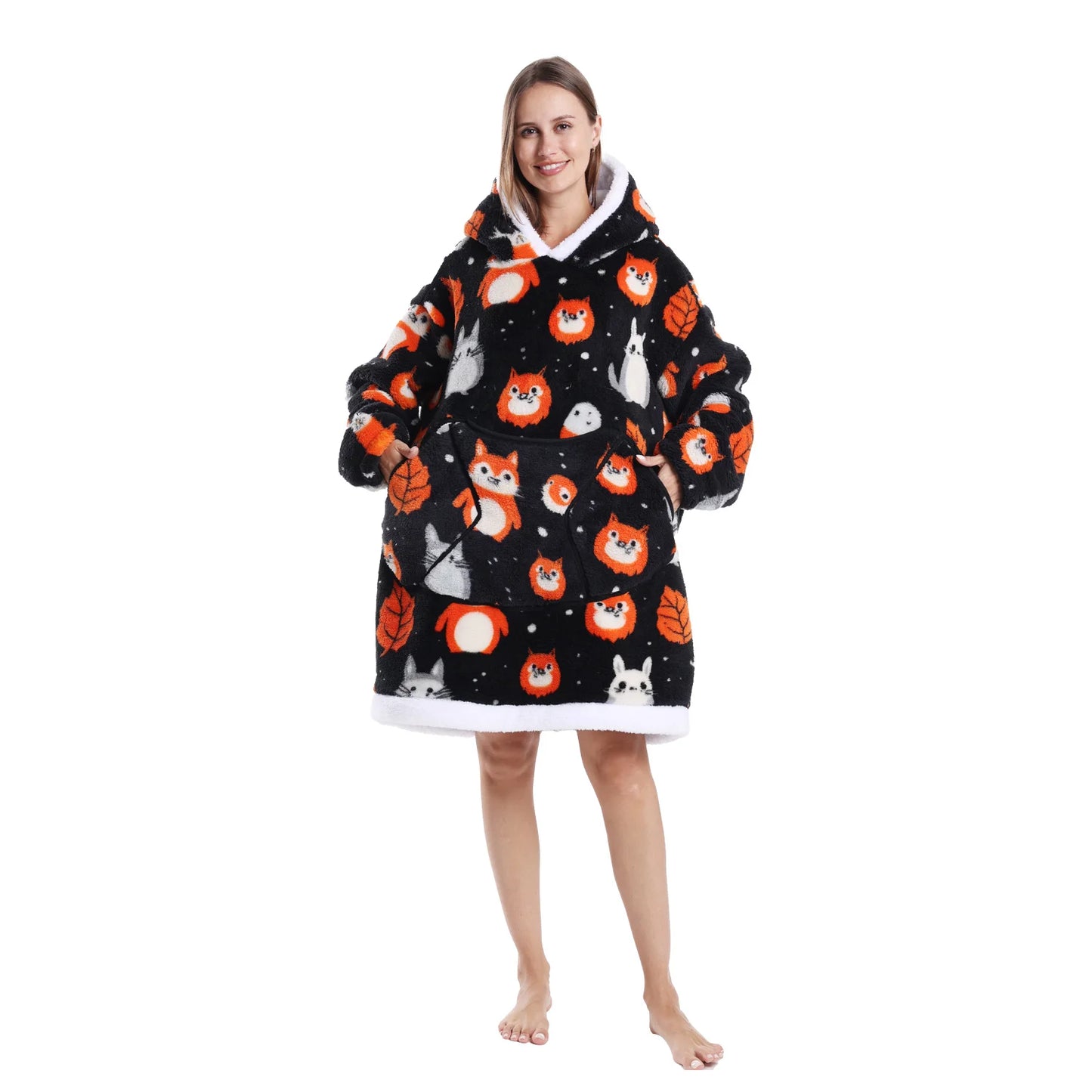 Woman wearing a multicoloured oversized lounge hoodie with woodland creature motifs on a white background
