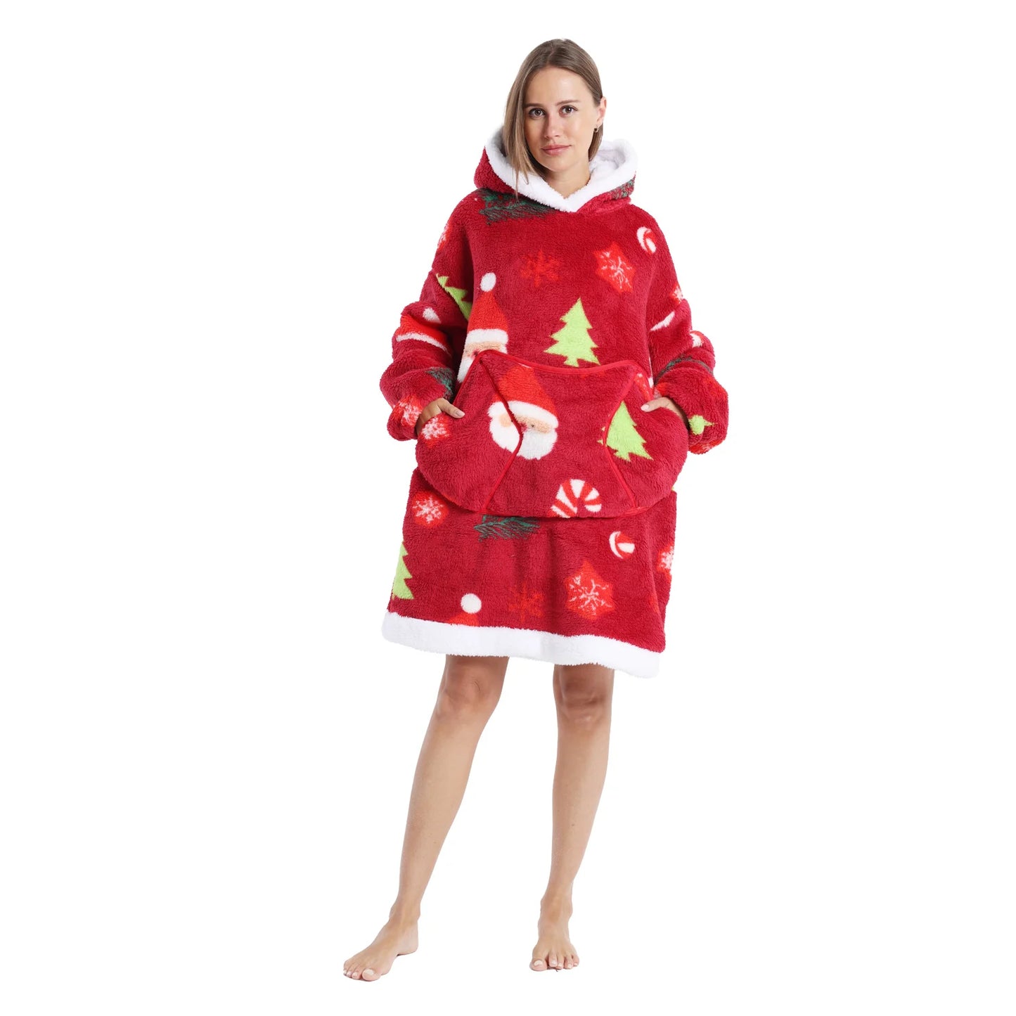 Woman wearing a red oversized Christmas themed hoodie with Santa and tree motifs