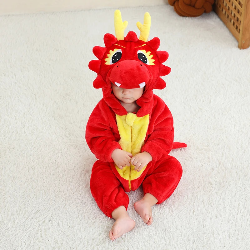 Baby in a red dragon costume sitting on a white floor.