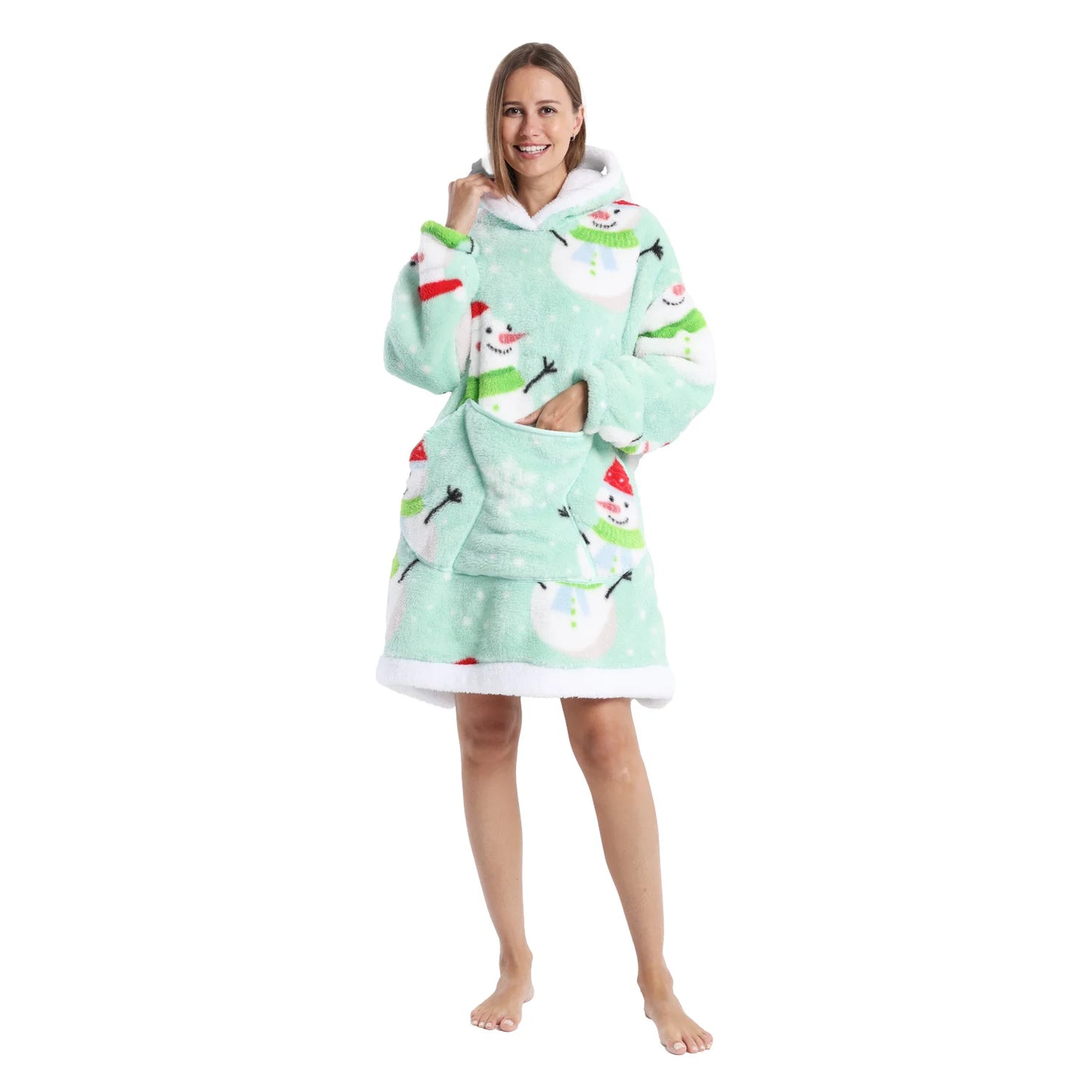 Woman wearing a green oversized Christmas themed hoodie with snowman motifs