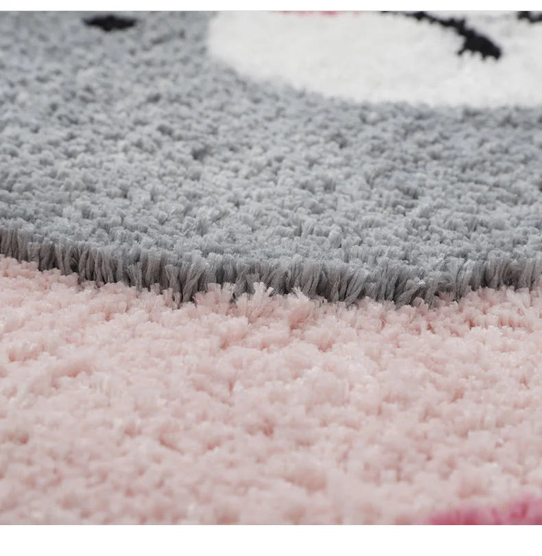 Close-up of a gray and pink textured rug
