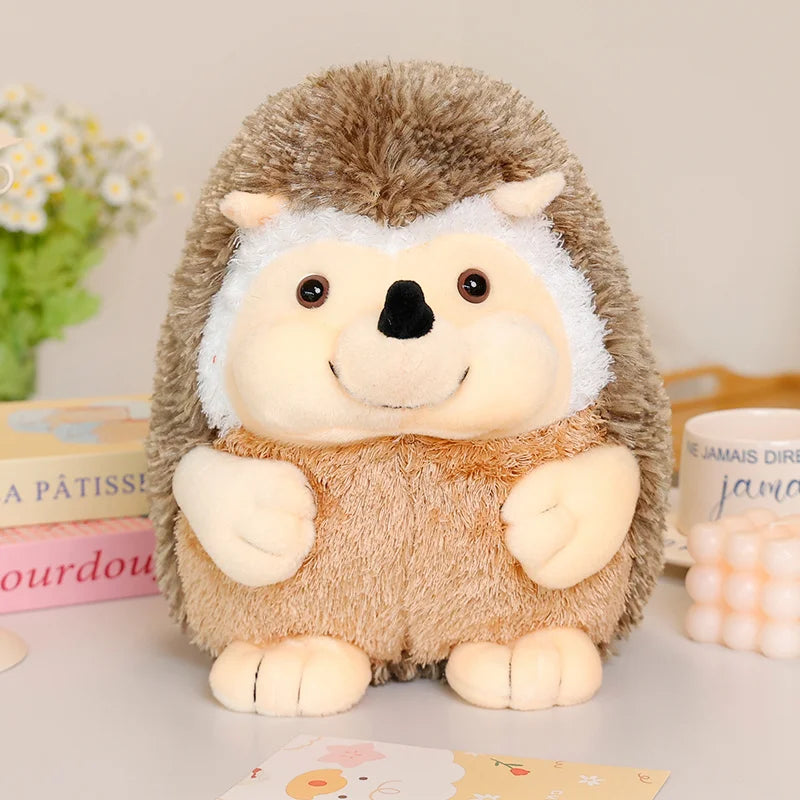 Plush hedgehog toy on a light surface with books and flowers in the background