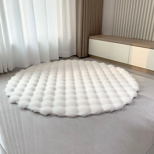 White round bubble velvet plush rug shown on a light tiled floor in a bright room