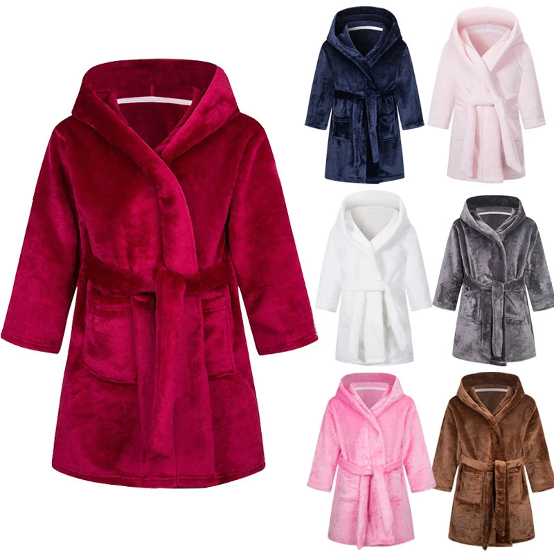 7 different coloured kids bath robes on a white background