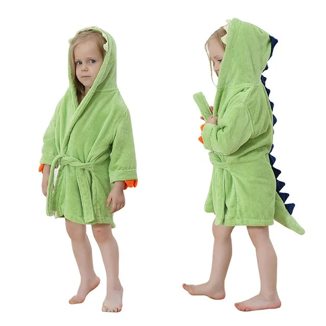 Green dinosaur-themed hooded baby bathrobe made from soft bamboo fabric with belt tie