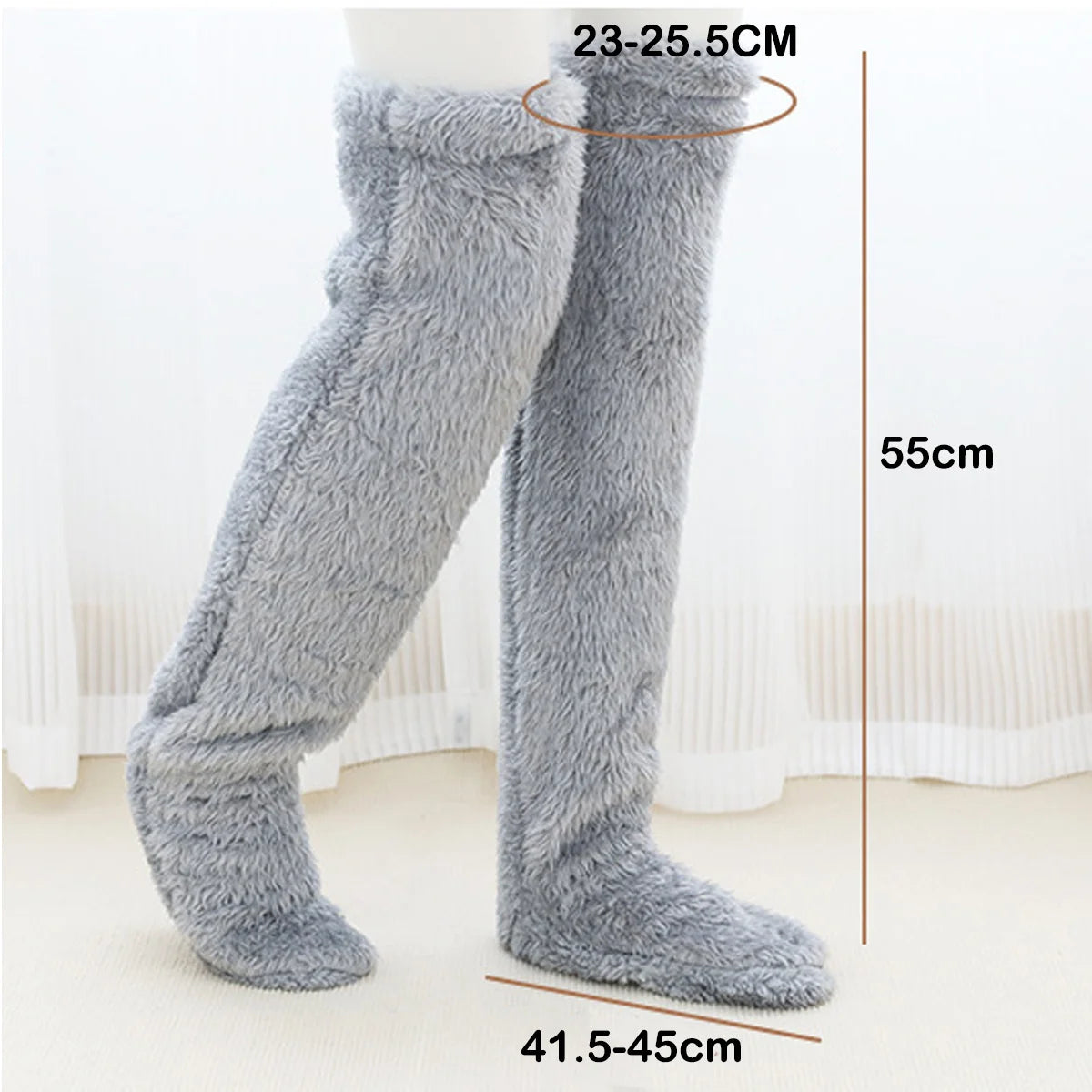 Grey fuzzy leg warmers with measurements on a white background