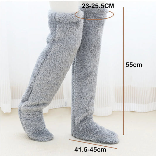 Grey fuzzy leg warmers with measurements on a white background