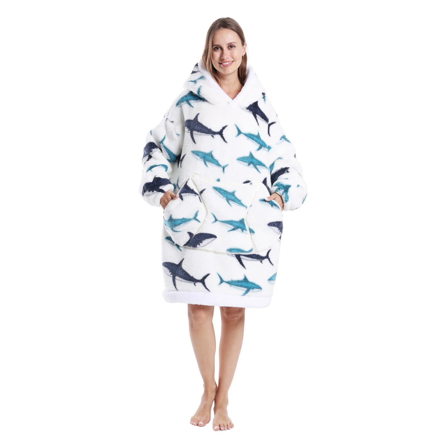 Woman wearing a white oversized lounge hoodie with shark motifs on a white background