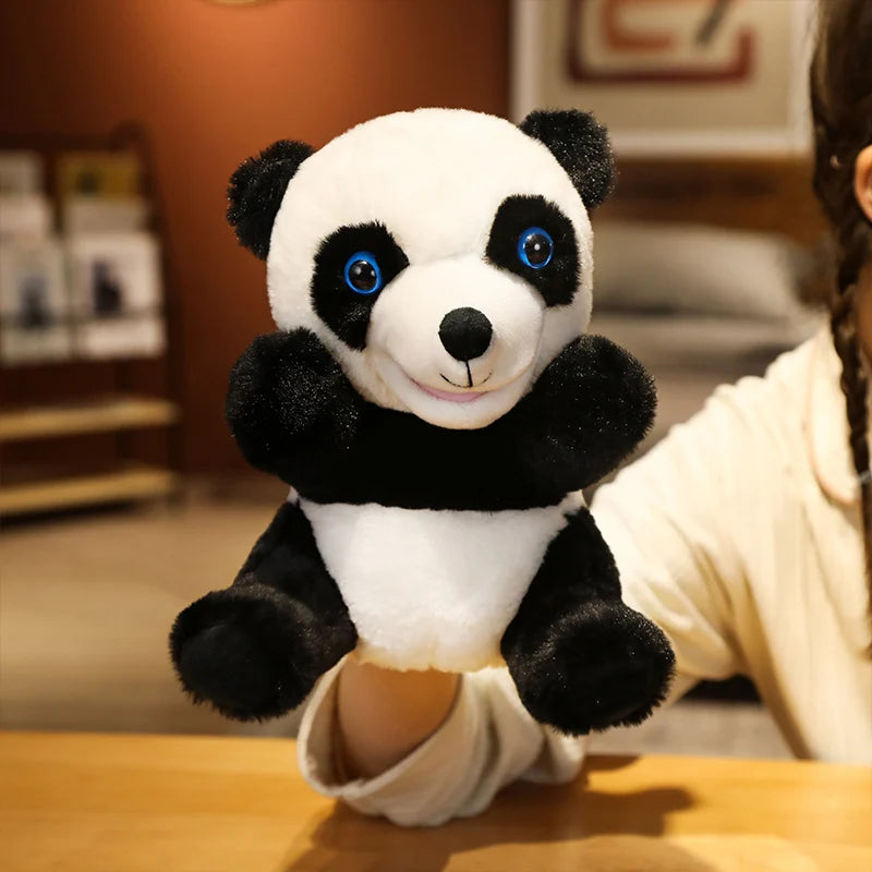 Plush panda hand puppet held by a person in an indoor setting