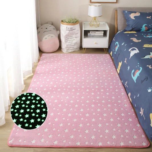 Pink star-patterned rug with a close-up of glowing stars in a bedroom setting.