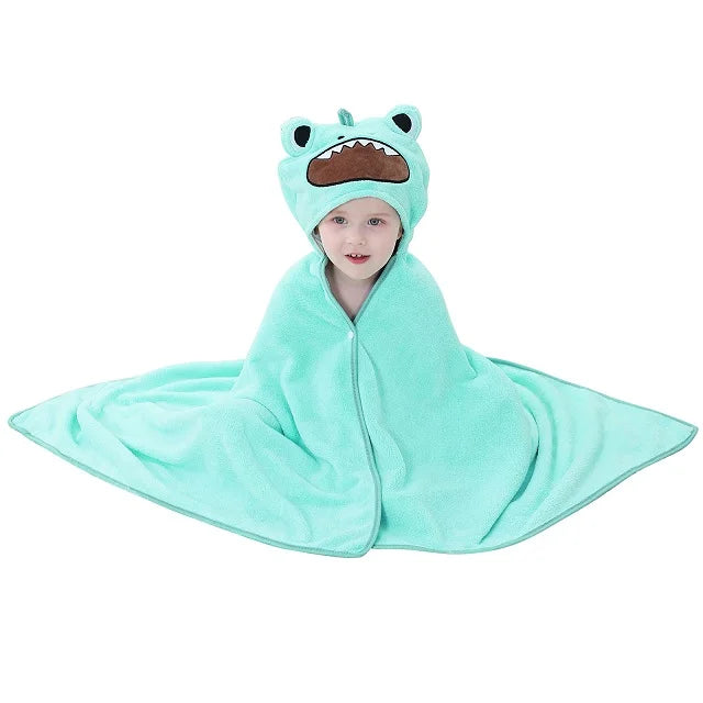 Child wearing a blue frog hood towel on a white background