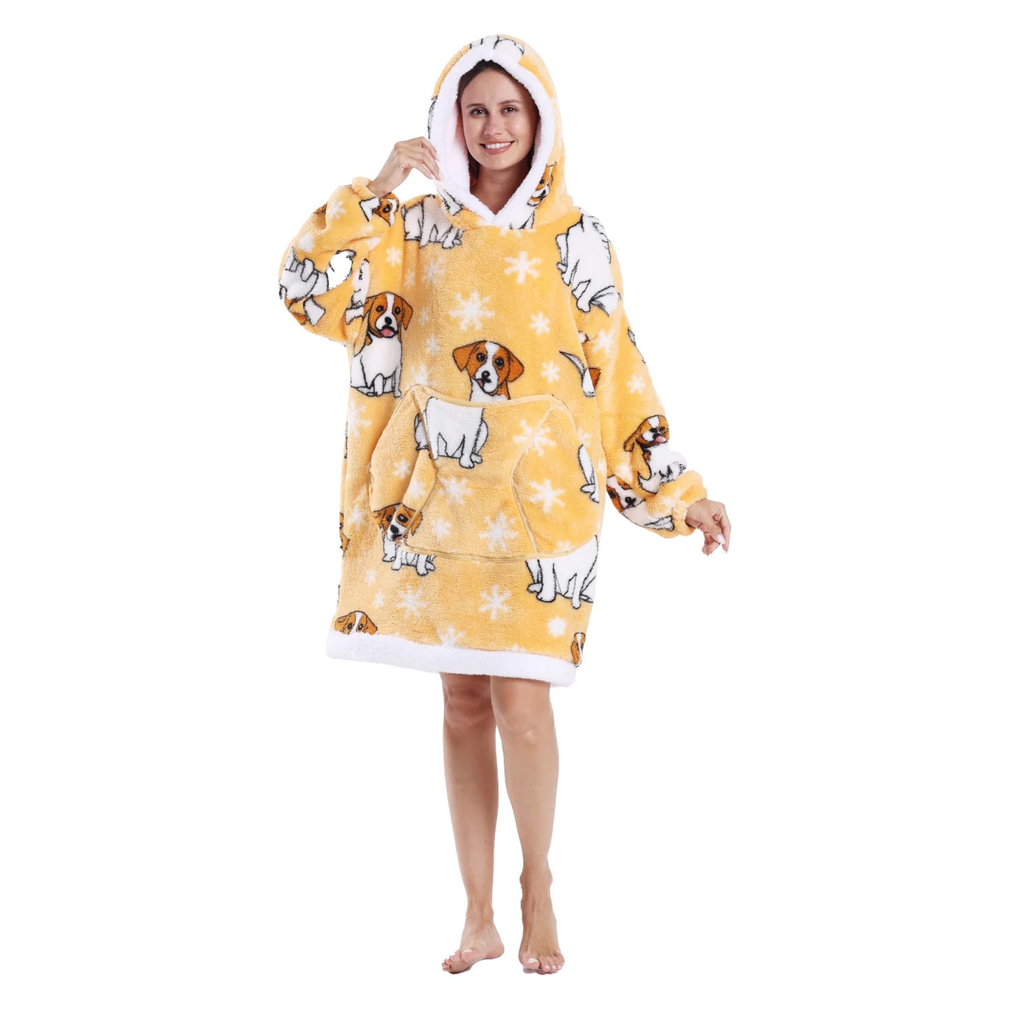 Woman wearing a yellow oversized lounge hoodie with dog motifs on a white background