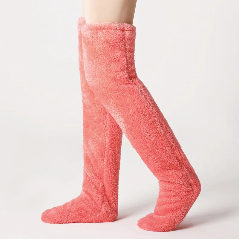 Red fuzzy socks on a white background