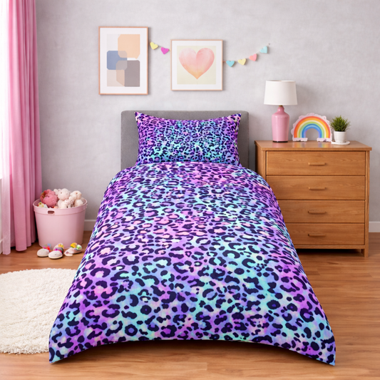 Bedroom with a colourful leopard print comforter on a bed, wooden nightstand, and decor items.