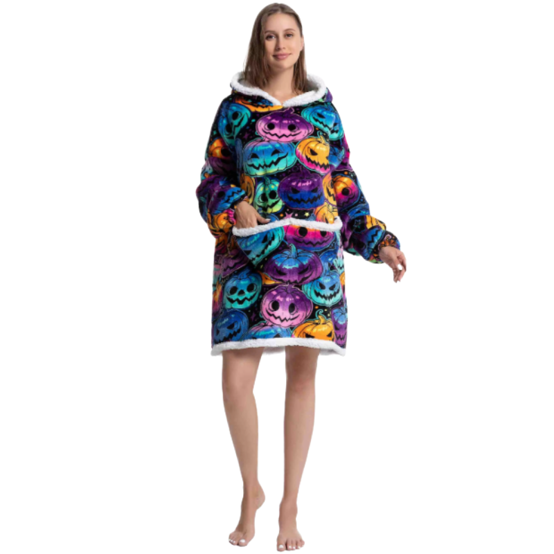 Woman wearing colourful oversized wearable hoodie with jack-o-lantern print and soft sherpa lining