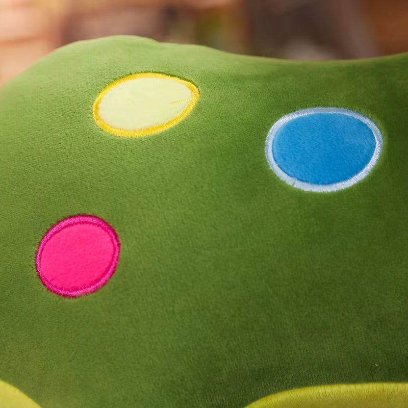 Close up of the detailing on the back of the soft plush triceratops toy.