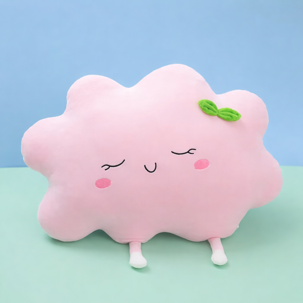 Pink cloud-shaped plush toy with a smiley face on a light blue and green background