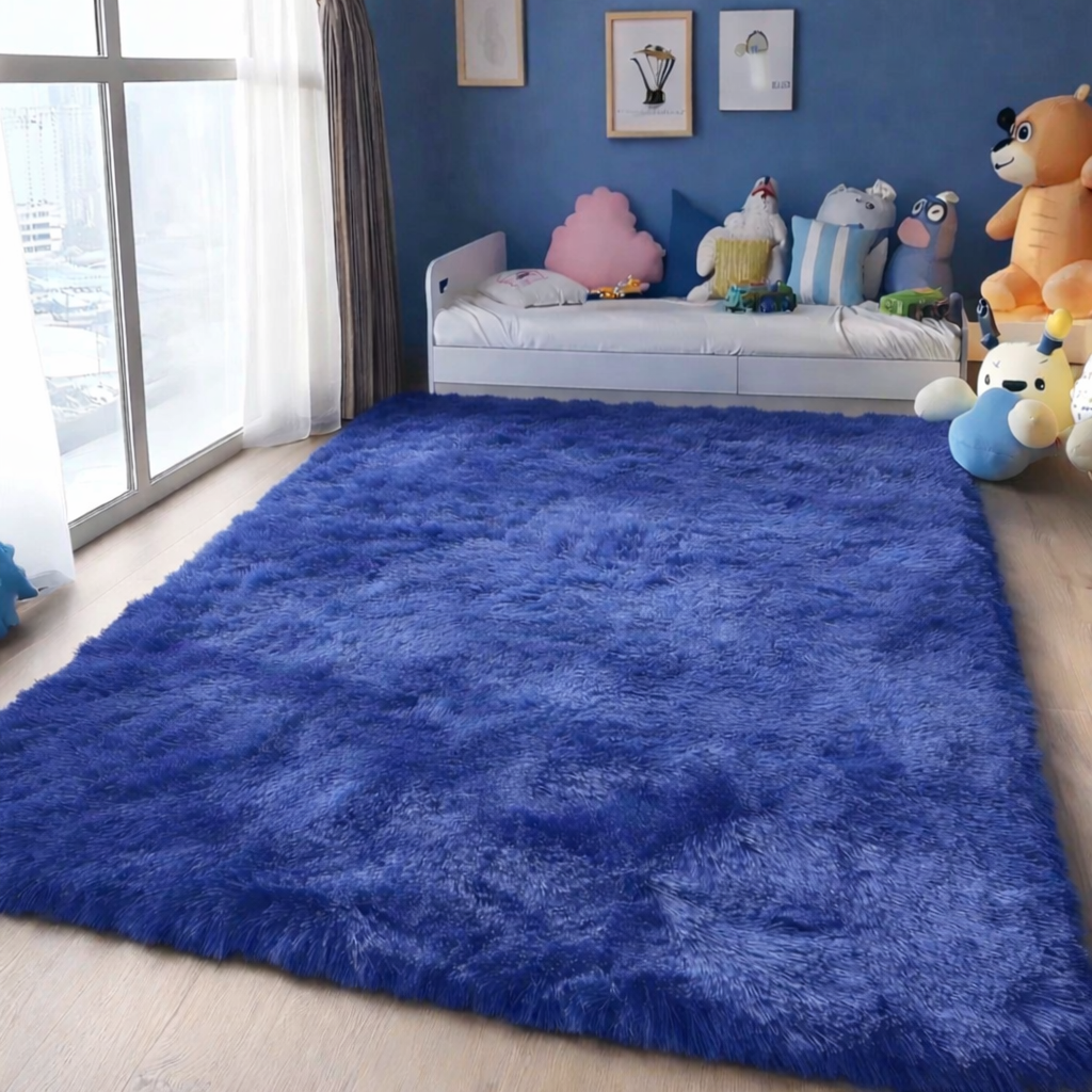 Blue fluffy rug in a room with toys and a bed.