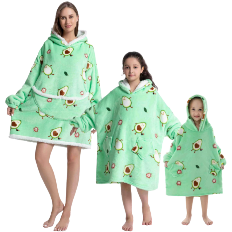 Adult and children wearing green oversized wearable hoodies with playful exploding avocado print and soft sherpa lining
