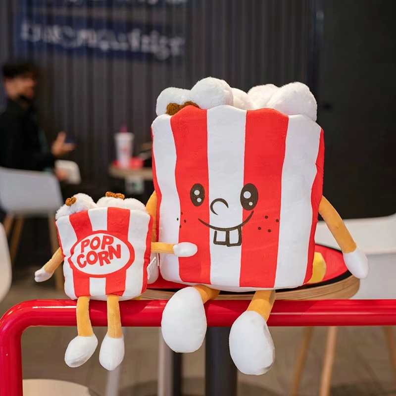 Popcorn fast food plush toy with red and white striped design and smiling face