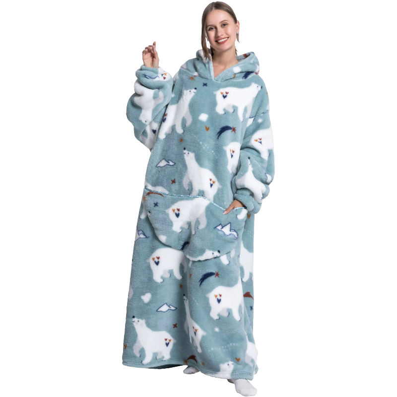 Person wearing a blue fleece onesie with polar bear pattern on a white background
